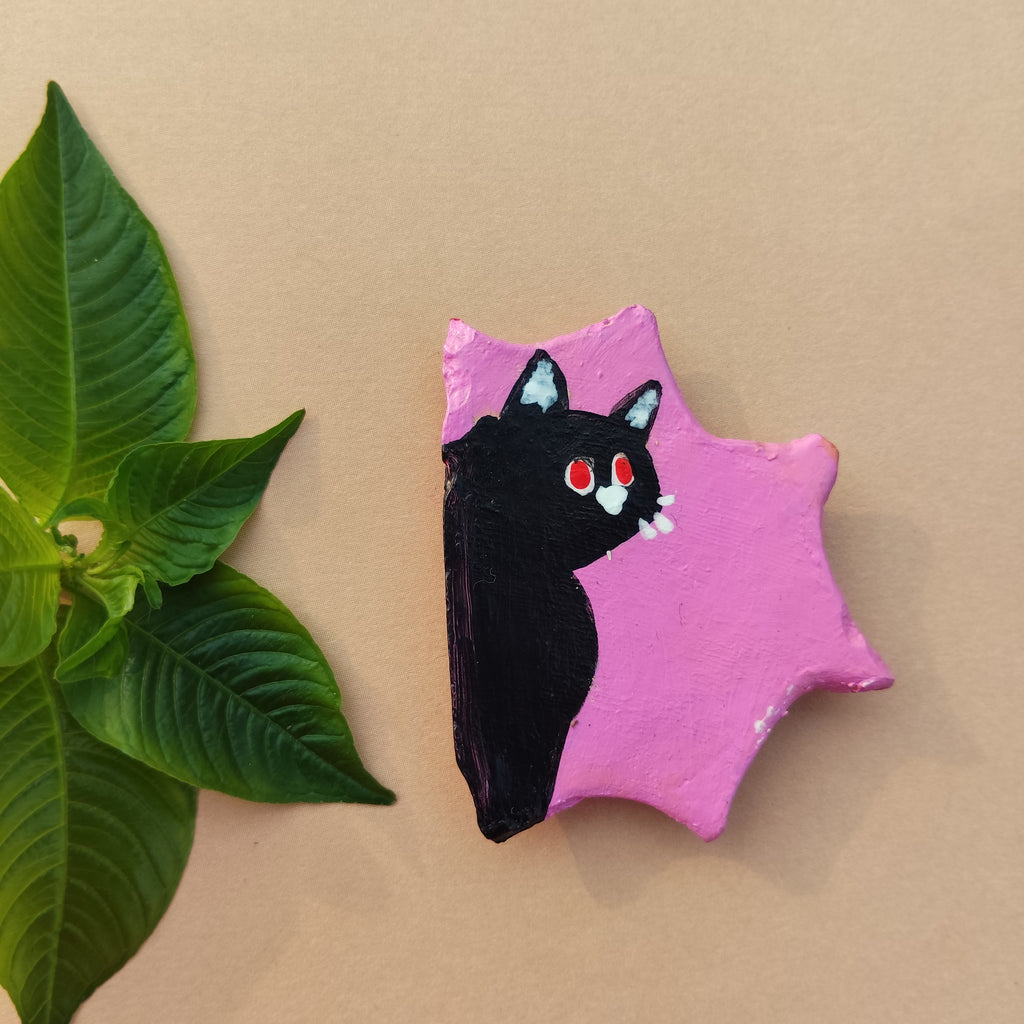 Pink handcrafted magnet with a black cat illustration on a beige background - Sustainable Home Decor