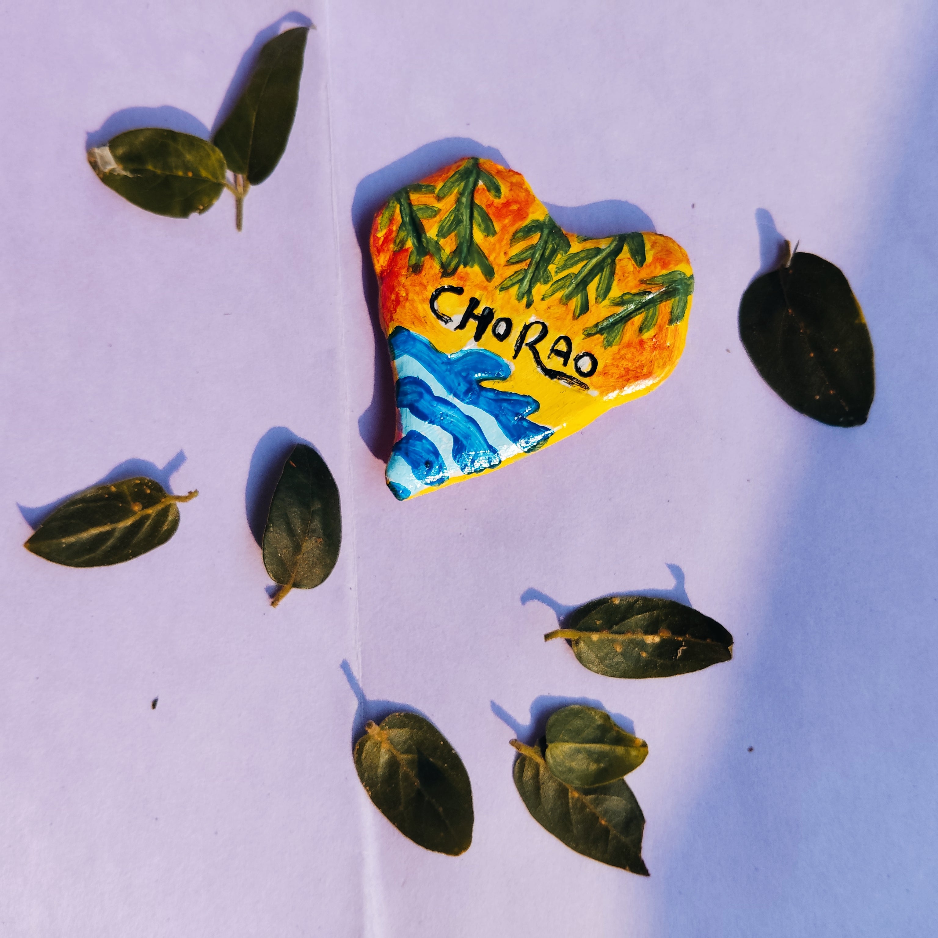 Heart-shaped fridge magnet with 'Chorao' text which is a beautiful Island in goa. Adding life to that heart through serene shades.