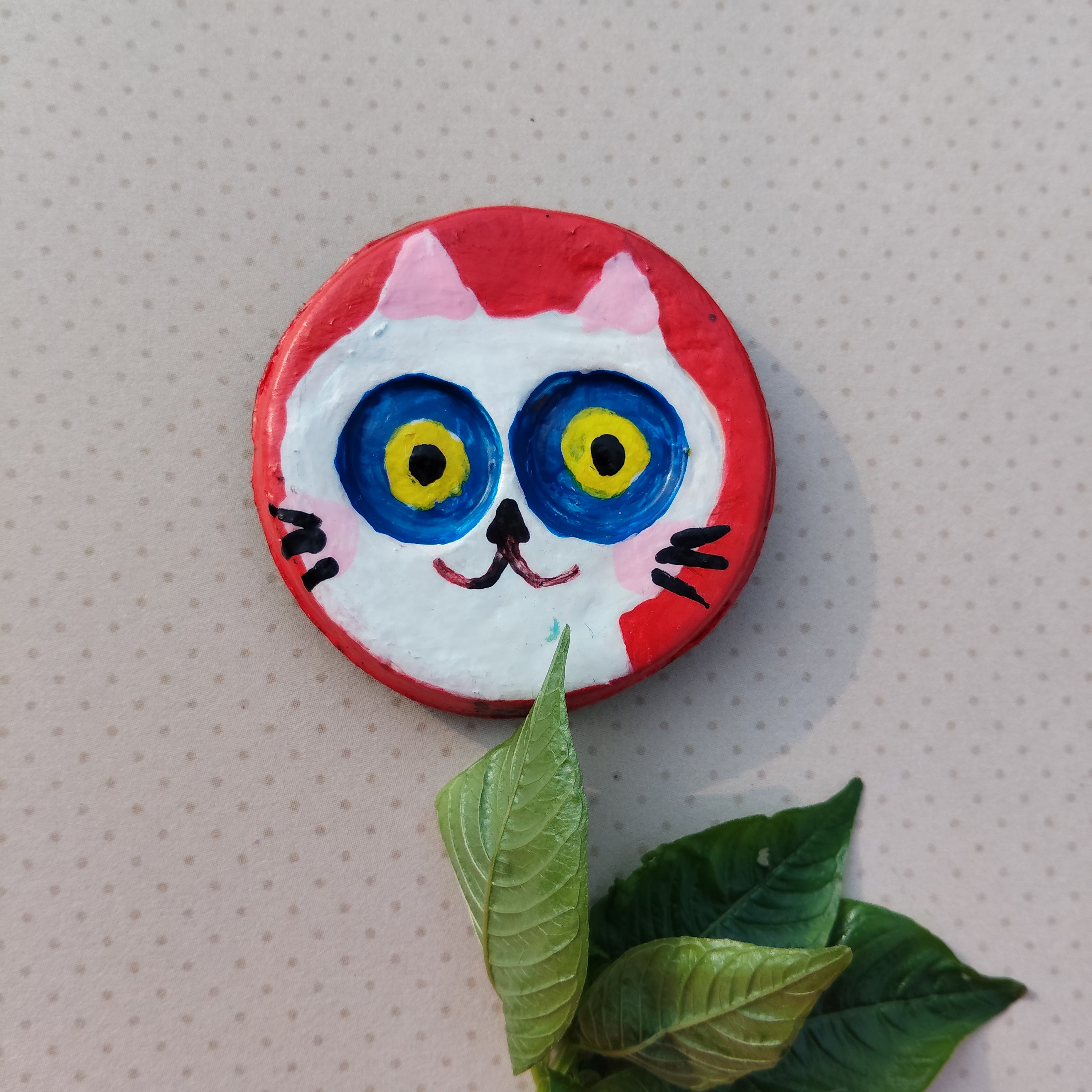 Colorful white cat-shaped magnet with leaves on a textured beige background - Sustainable Home Decor & Upcycled Glass