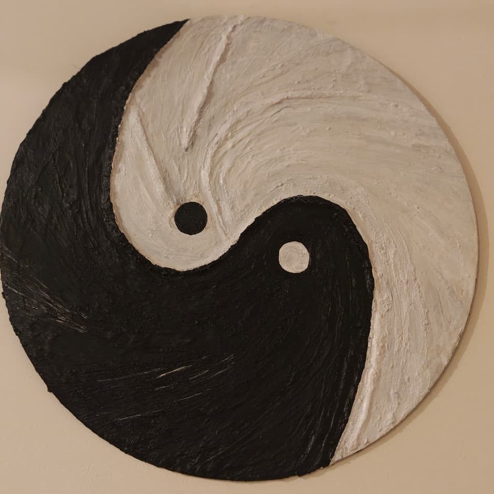Textured art yin and yang symbol on a beige background