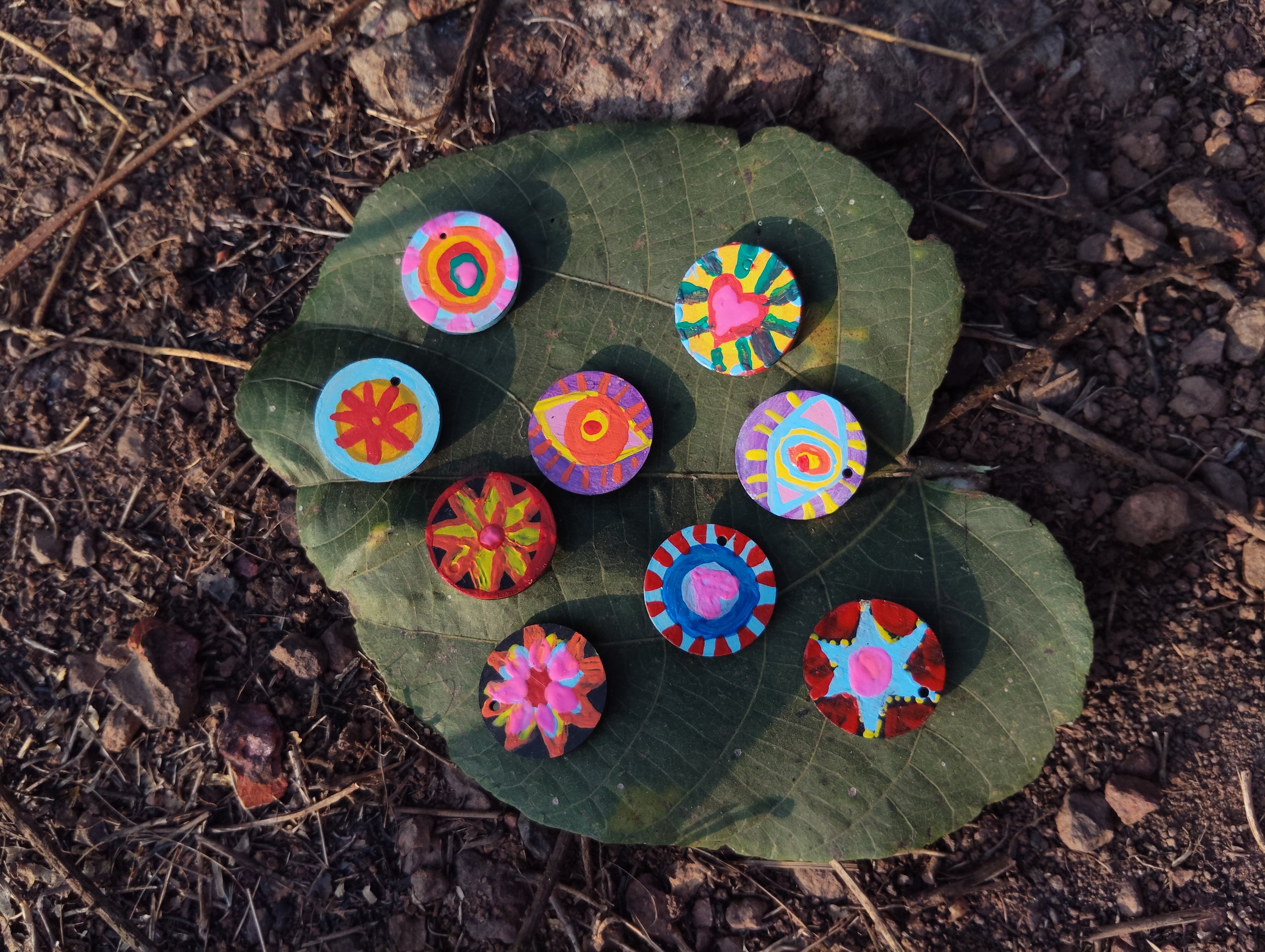 A girl showing her ecofriendly and upcycled miniature magnets and also making the audience aware about the difference b/w eco-friendly and upcycled.
